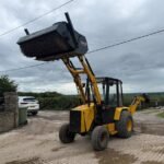 Lewis Badger 4WD Front Loader Backhoe With 2023 Suton Hydraulic Sweeper Bucket - Image 4